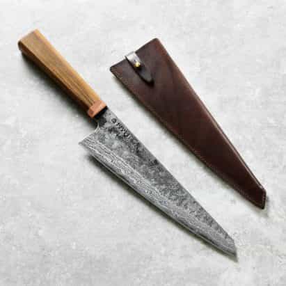 La competencia: ganar una medida cuchillo del cocinero hecho a mano
