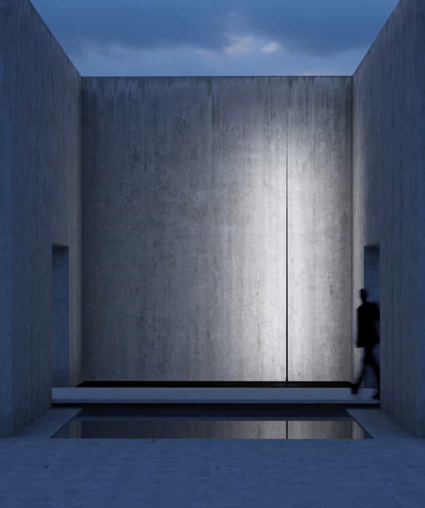 Una fotografía de la estrecha luz negra mate Origine iluminando un edificio de hormigón