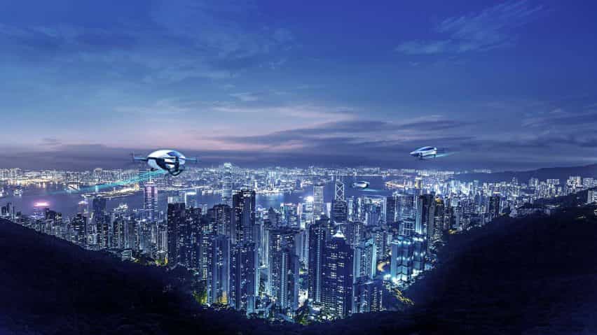 Representación del avión personal XPeng volando sobre el horizonte de una ciudad